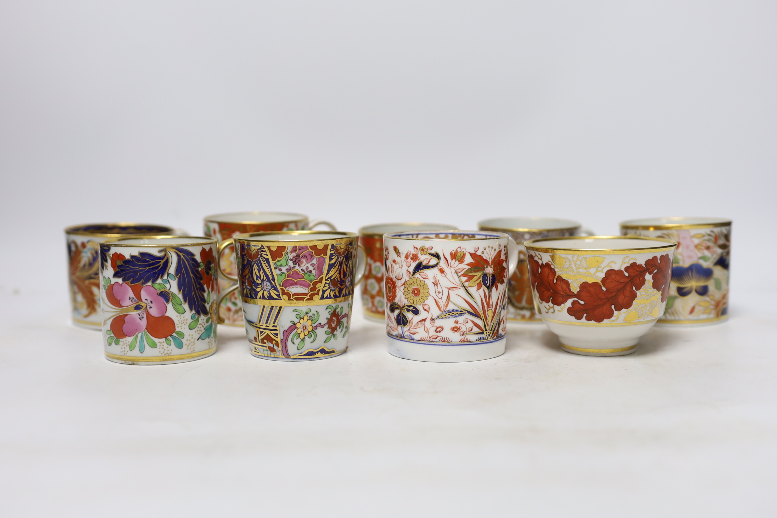 Twelve 1800-1820 English porcelain coffee cans and tea cups, including Imari pattern examples